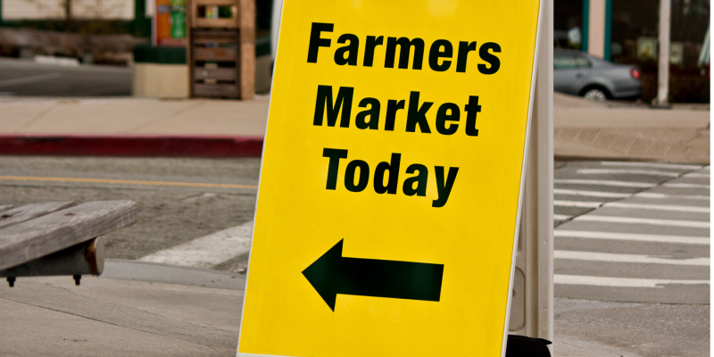 Yellow A-Frame Sign with Farmers Market Today in black text