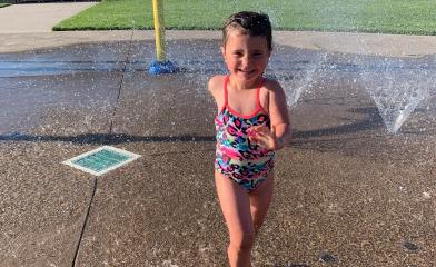 photo of child running through the Virgil Sports Park Splashpad