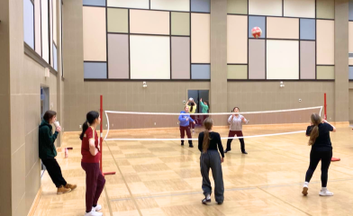 Youth playing in the community centre gym during a drop-in program.