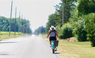 A couple cycling down a country road