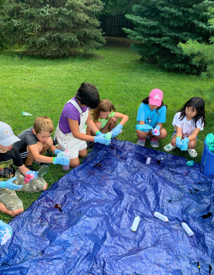 Campers enjoying outdoor crafts during Summer Camp.