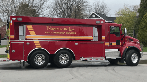 A large red tanker truck
