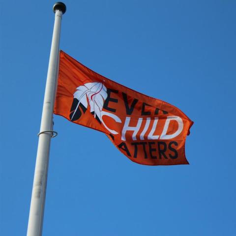 Every Child Matter Orange Flag waving in the sky